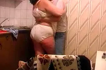 Big grandma get fucked by her boytoy in the kitchen - free porn video